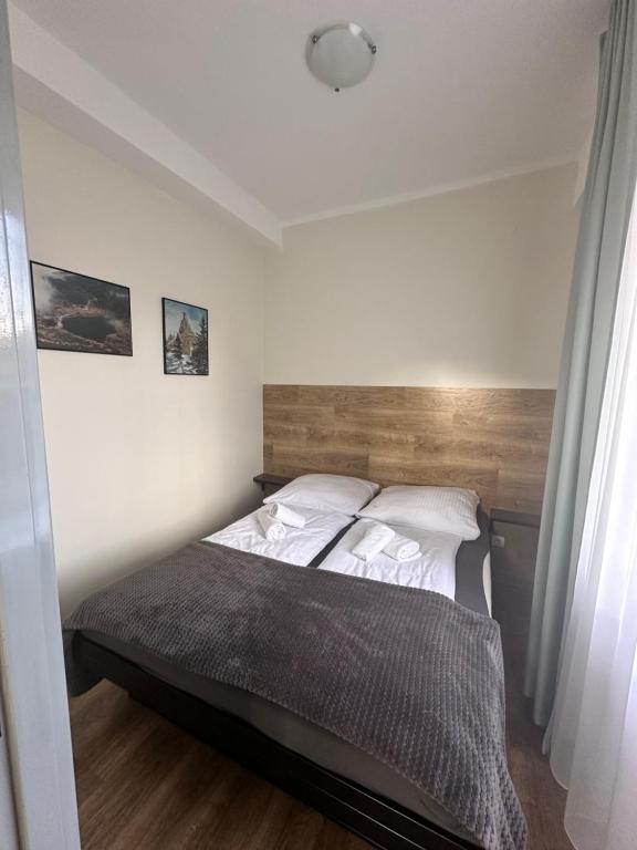 Posteľ alebo postele v izbe v ubytovaní Apartament, Pokoje Koniczynka