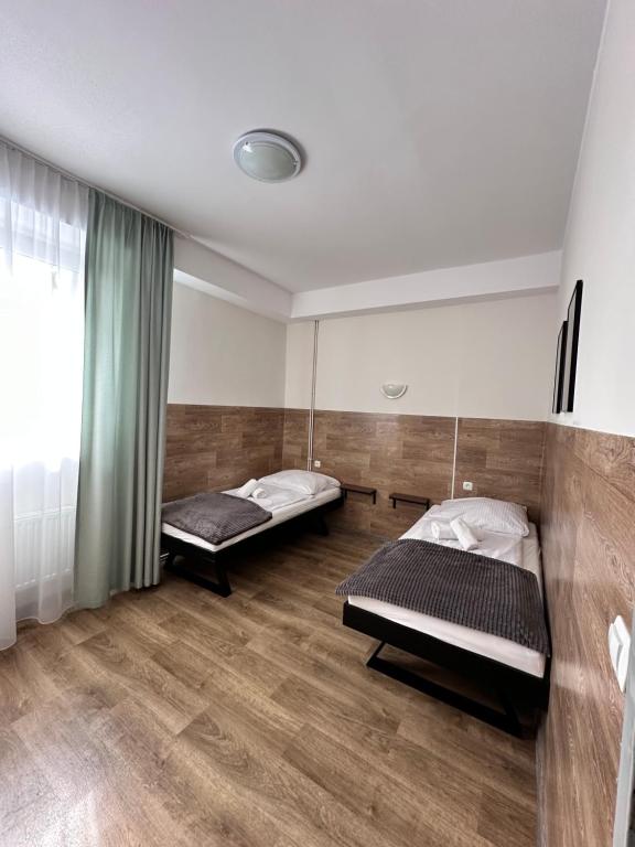 Posteľ alebo postele v izbe v ubytovaní Apartament, Pokoje Koniczynka