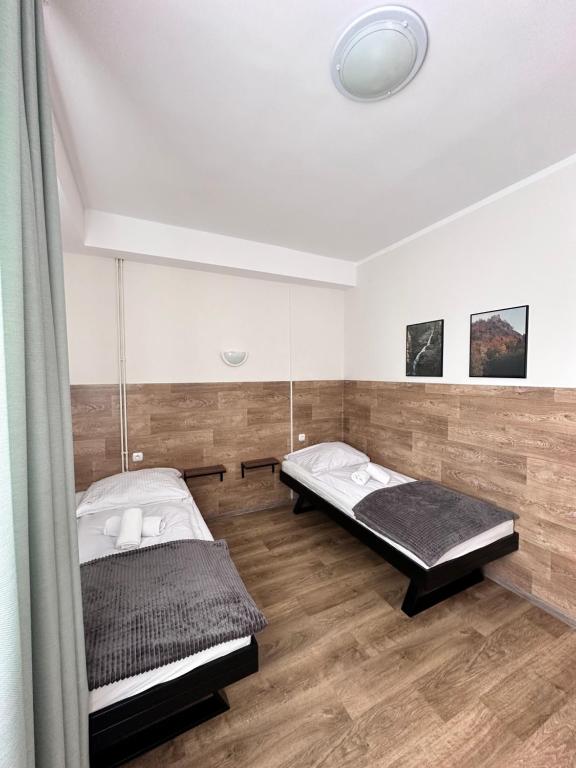 Posteľ alebo postele v izbe v ubytovaní Apartament, Pokoje Koniczynka