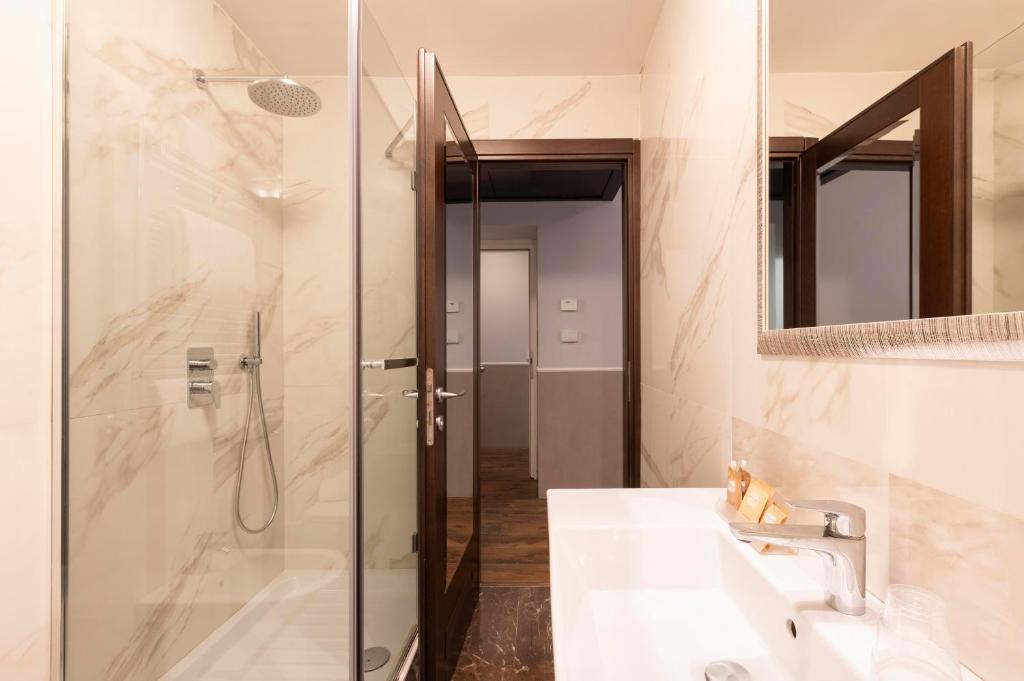 Um banheiro em Hotel Virgilio
