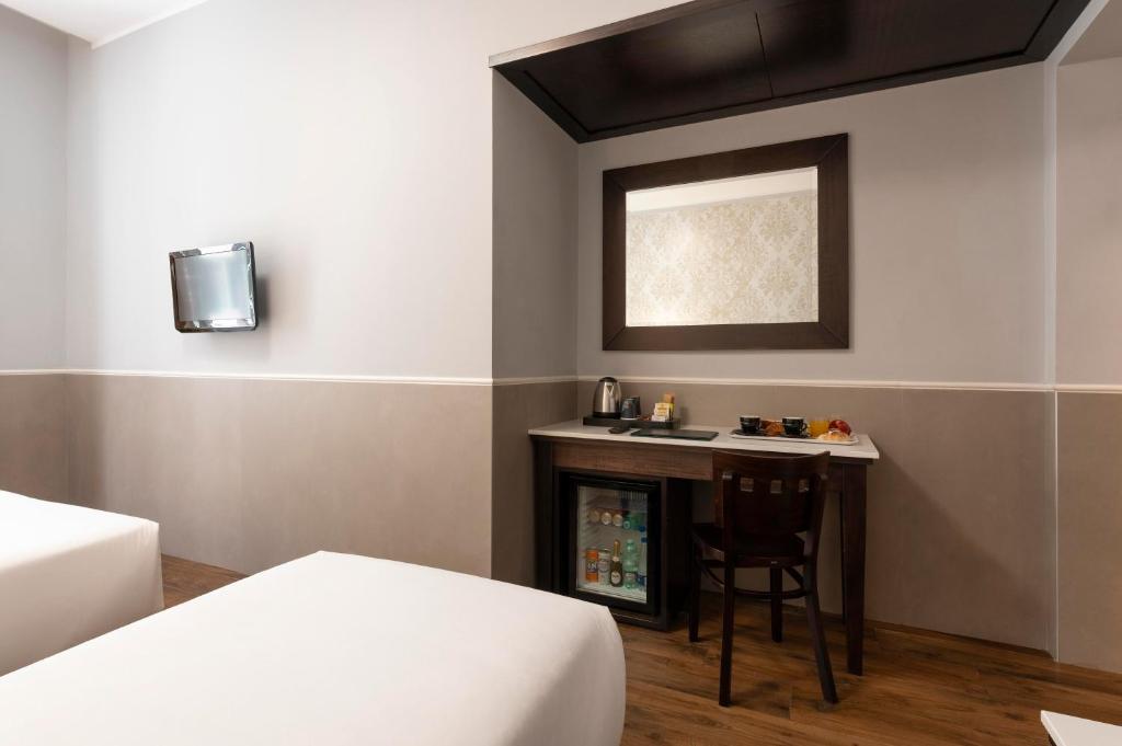 Cama ou camas em um quarto em Hotel Virgilio