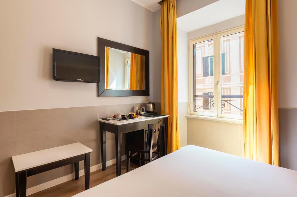 Cama ou camas em um quarto em Hotel Virgilio