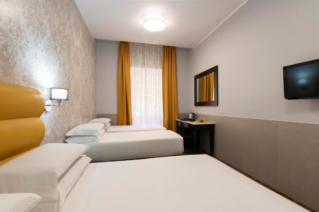Cama ou camas em um quarto em Hotel Virgilio