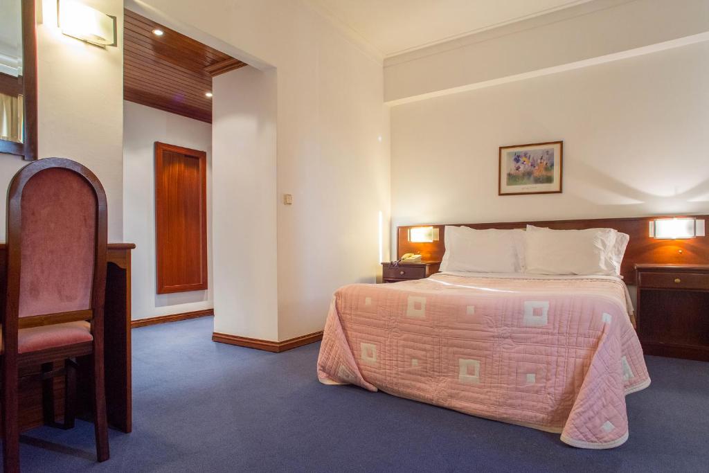 Postel nebo postele na pokoji v ubytování Hotel Boavista I