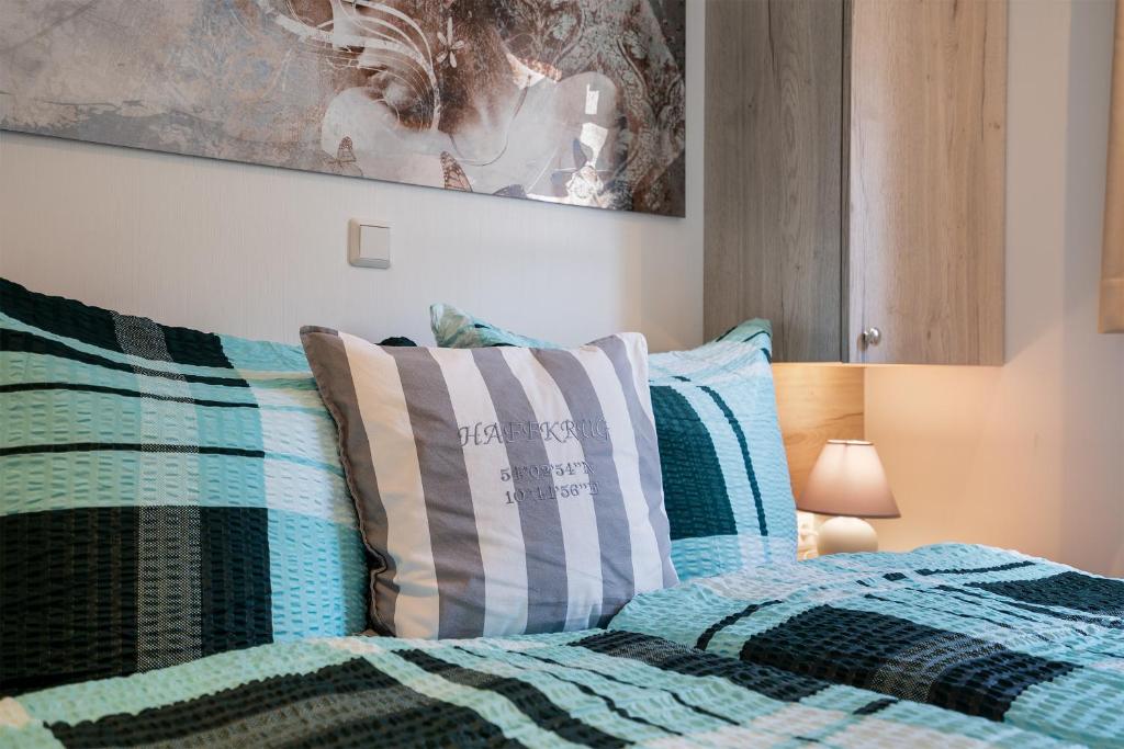 Postel nebo postele na pokoji v ubytování Casa del Mar Scharbeutz - Sauna kostenlos - 1 kleiner Hund willkommen - umzäunter Garten