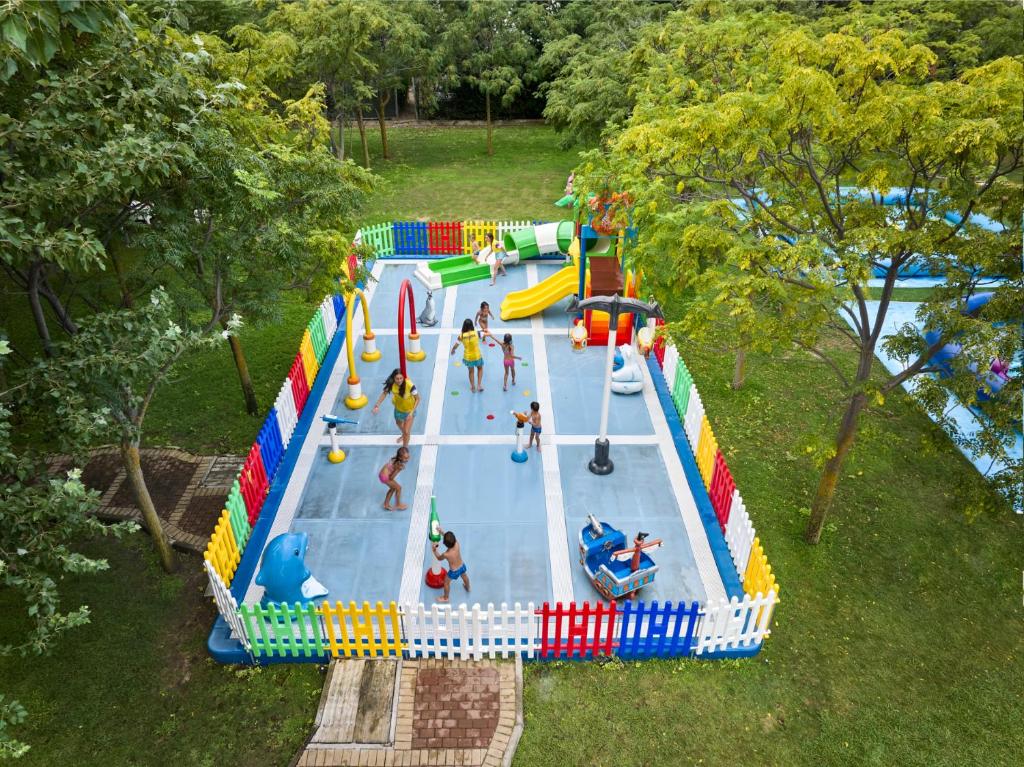 an overhead view of an inflatable water park with people on it at Calaserena Resort in Geremèas