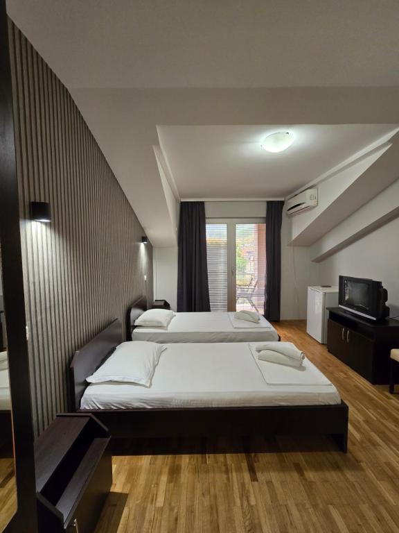 Postel nebo postele na pokoji v ubytování Apartments Philip II