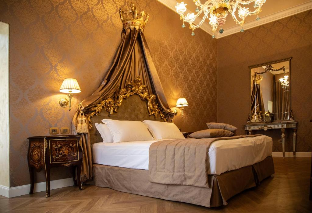 Postel nebo postele na pokoji v ubytování Palazzo dei Mori