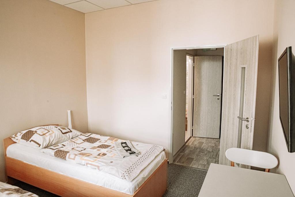 Postel nebo postele na pokoji v ubytování Penzion Centra Zdraví