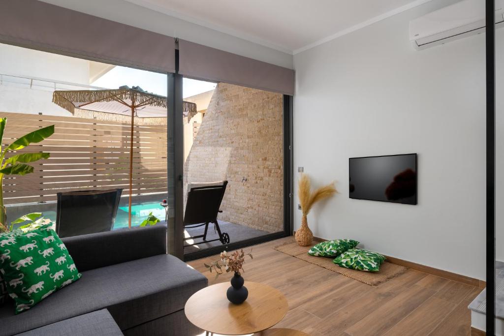 Télévision ou salle de divertissement dans l'établissement La Siesta Villas