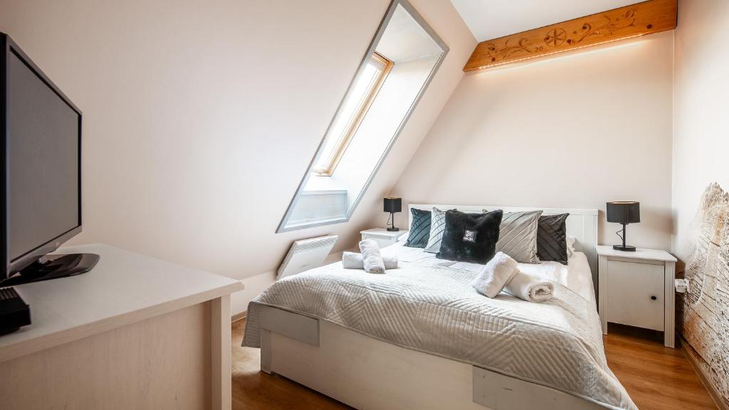 Posteľ alebo postele v izbe v ubytovaní Apartament Pardałówka Prestige