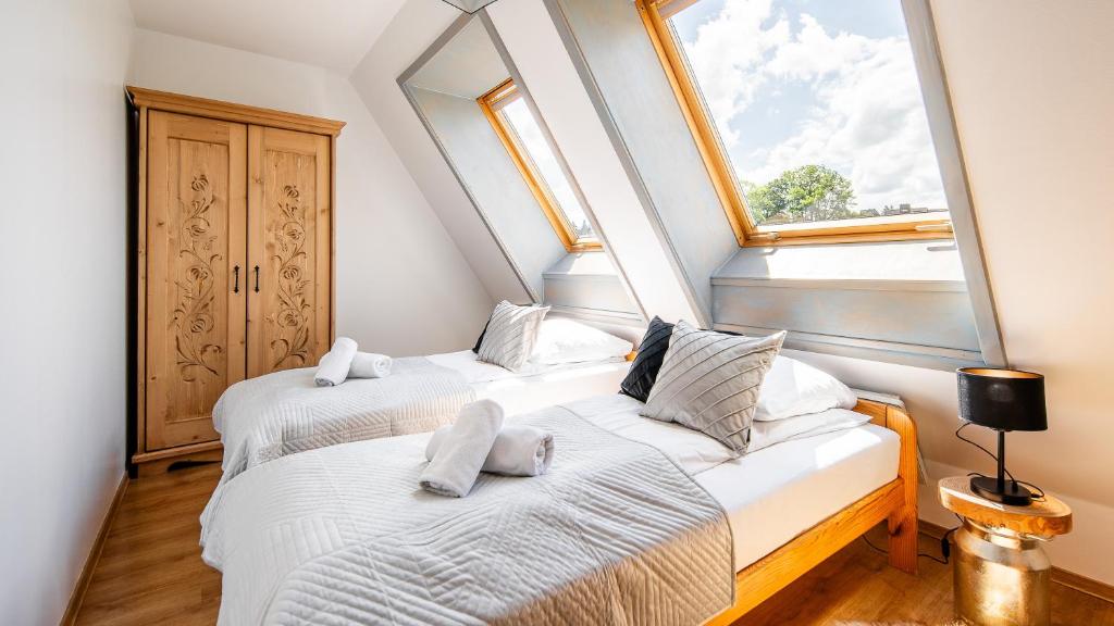 Posteľ alebo postele v izbe v ubytovaní Apartament Pardałówka Prestige