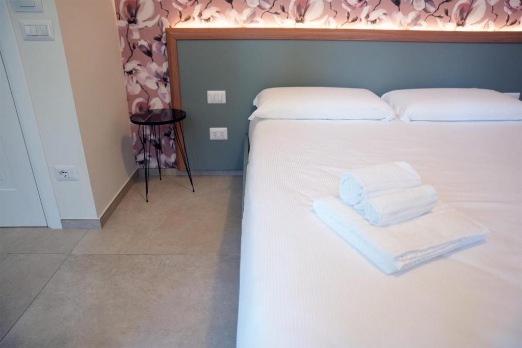 Postel nebo postele na pokoji v ubytování Annunziatella Suite & Rooms
