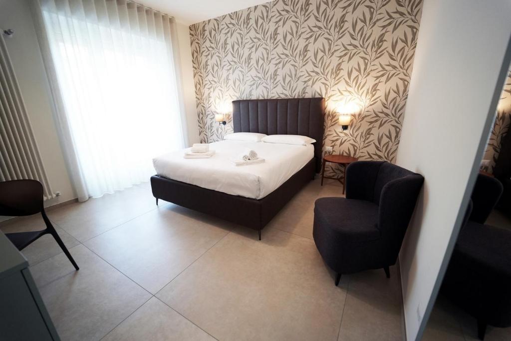 Postel nebo postele na pokoji v ubytování Annunziatella Suite & Rooms