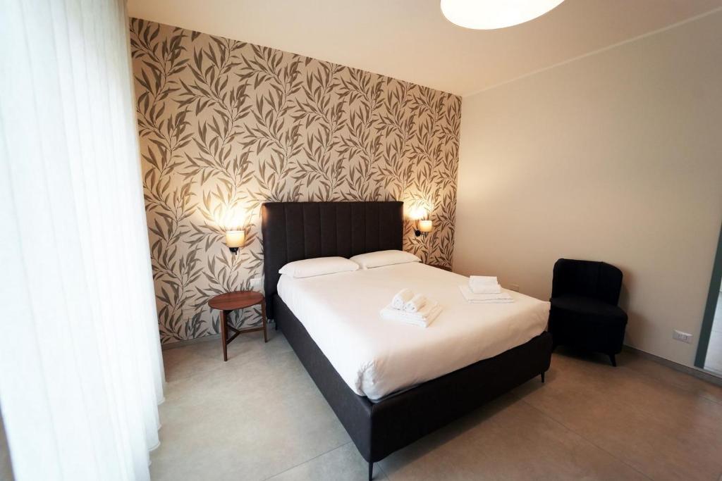 Postel nebo postele na pokoji v ubytování Annunziatella Suite & Rooms