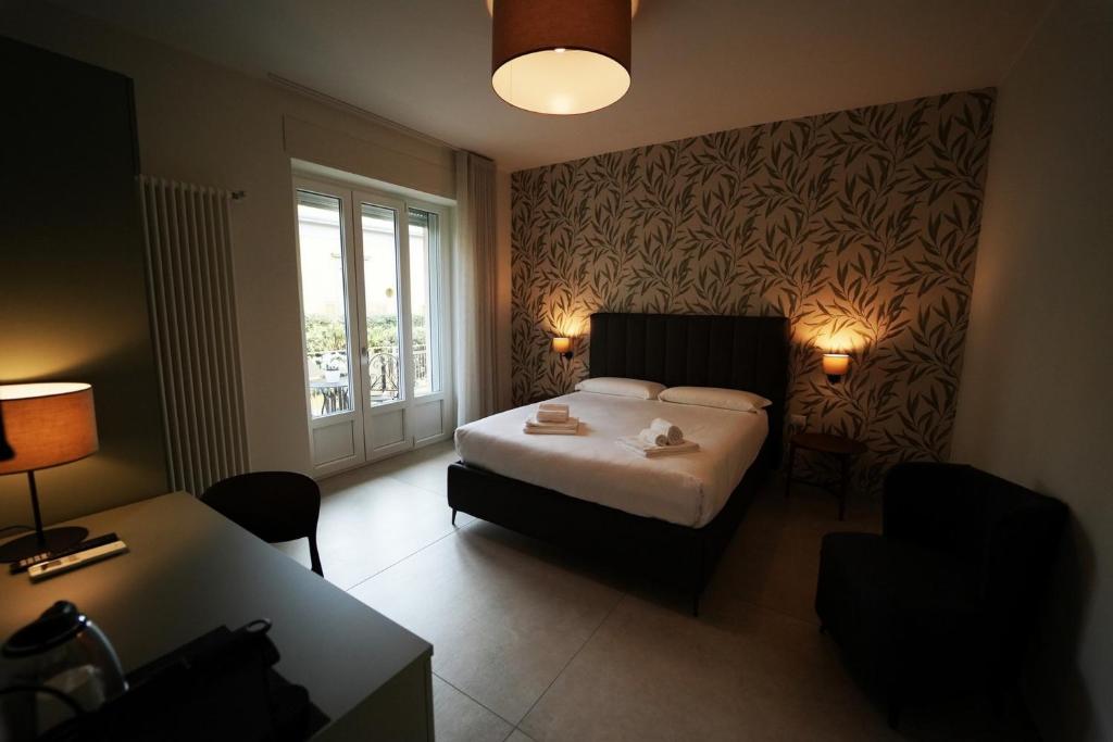 Postel nebo postele na pokoji v ubytování Annunziatella Suite & Rooms