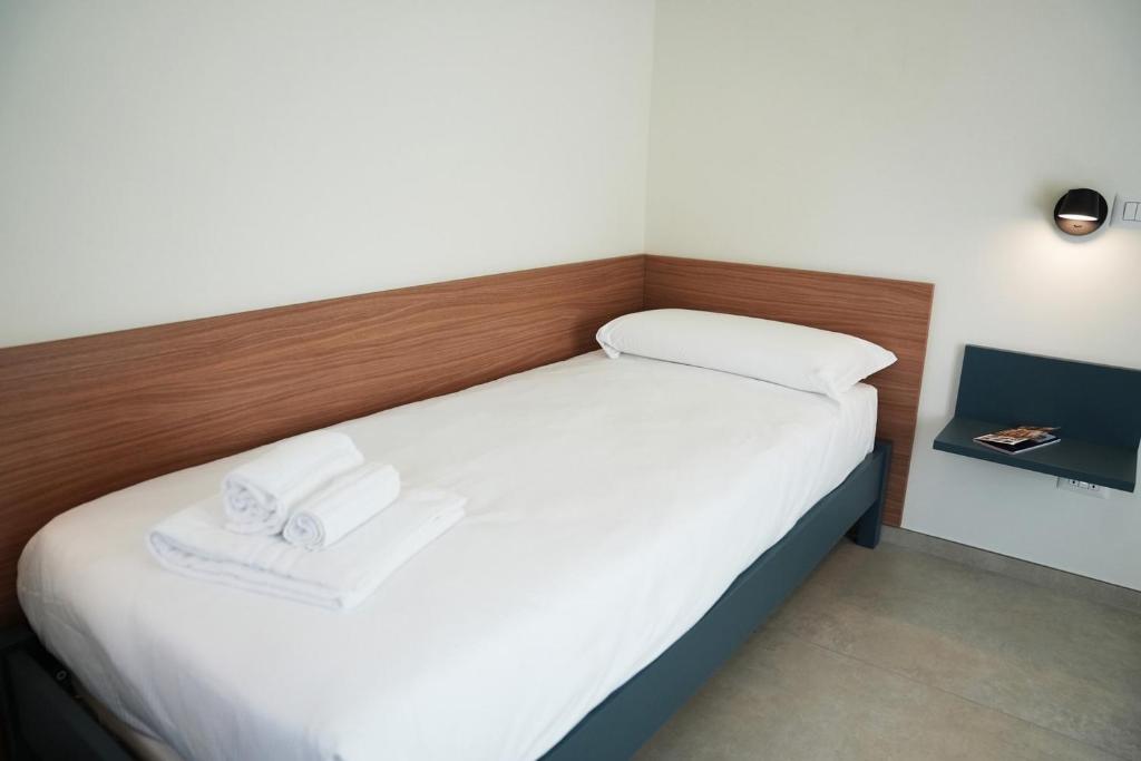 Postel nebo postele na pokoji v ubytování Annunziatella Suite & Rooms