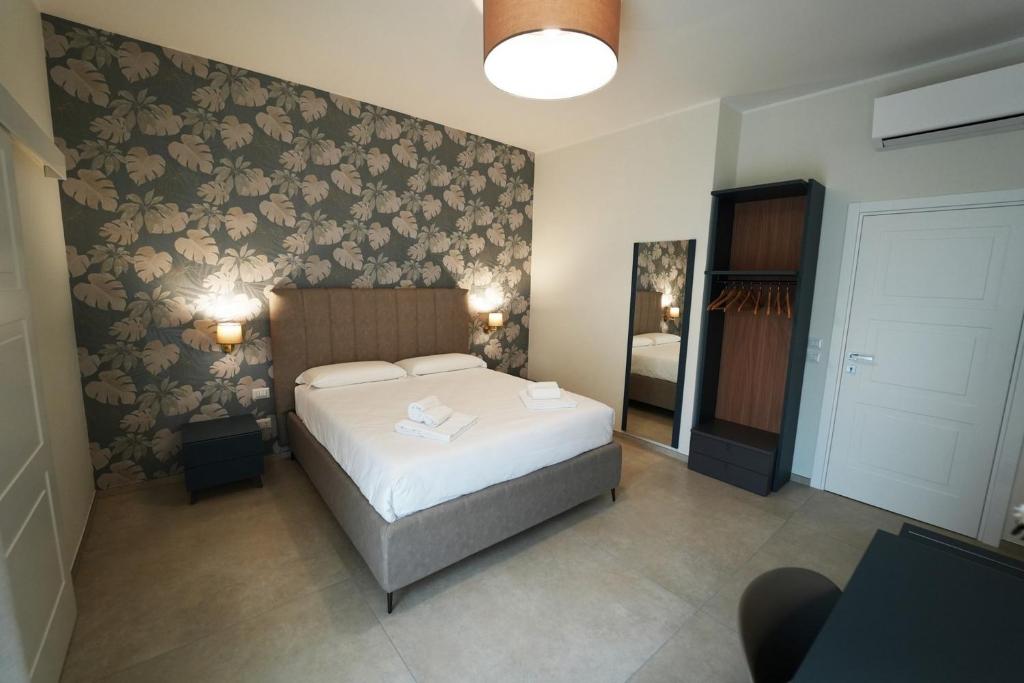 Postel nebo postele na pokoji v ubytování Annunziatella Suite & Rooms