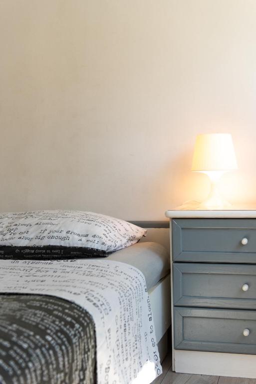 Posteľ alebo postele v izbe v ubytovaní Laghanini Apartments