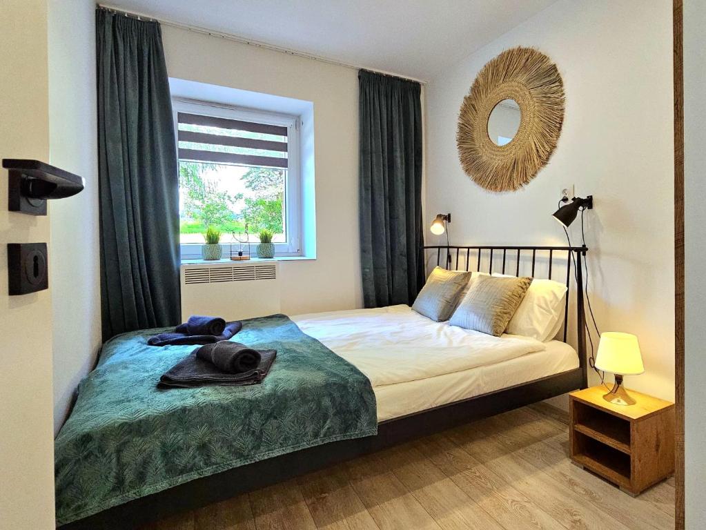 Posteľ alebo postele v izbe v ubytovaní Apartament Słoneczne Okno