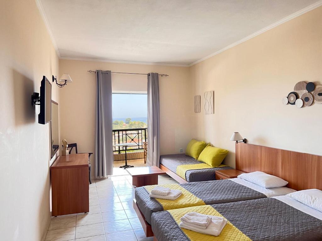 Postel nebo postele na pokoji v ubytování Ariadne Apartments