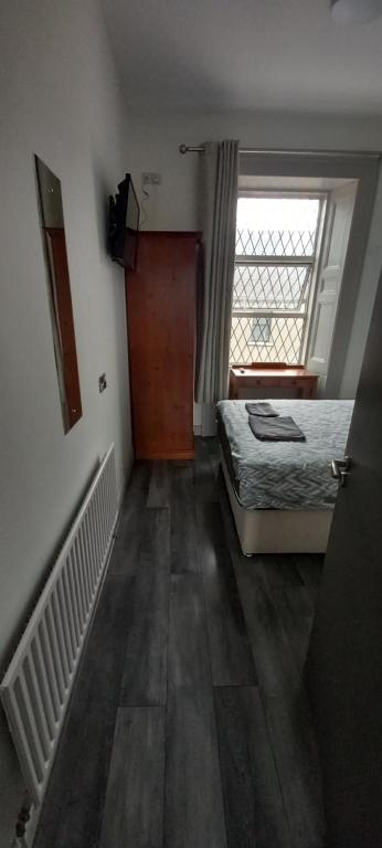 Voodi või voodid majutusasutuse Maid Of Erin Guesthouse toas