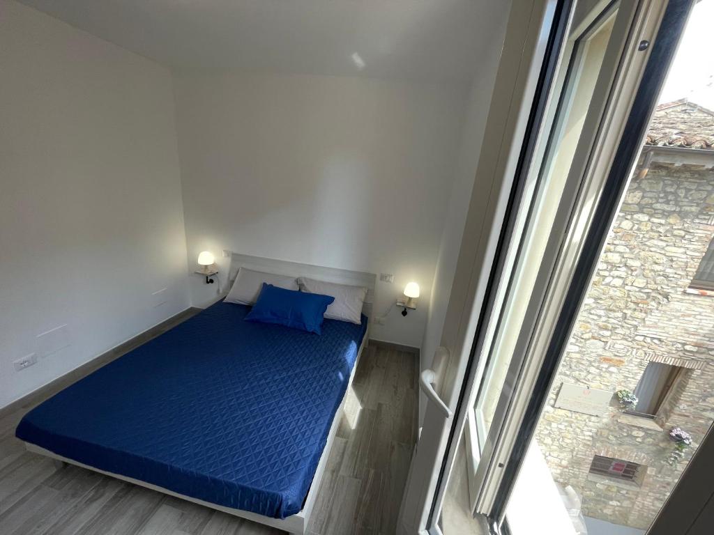 Postel nebo postele na pokoji v ubytování Locanda Francescana