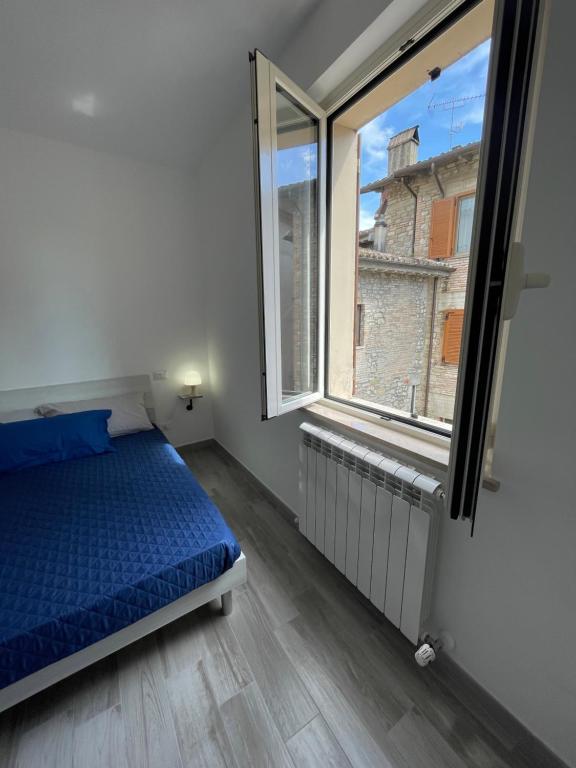 Postel nebo postele na pokoji v ubytování Locanda Francescana