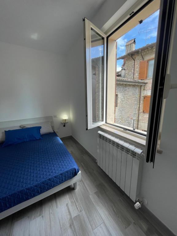 Postel nebo postele na pokoji v ubytování Locanda Francescana