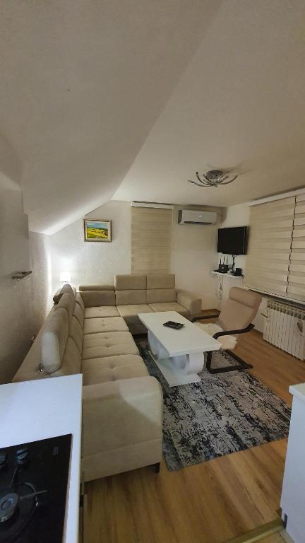 a living room with a couch and a table at Central View Apartment 2 Sarajevo in Sarajevo