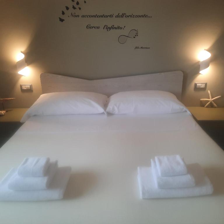 Letto o letti in una camera di AlmaRé