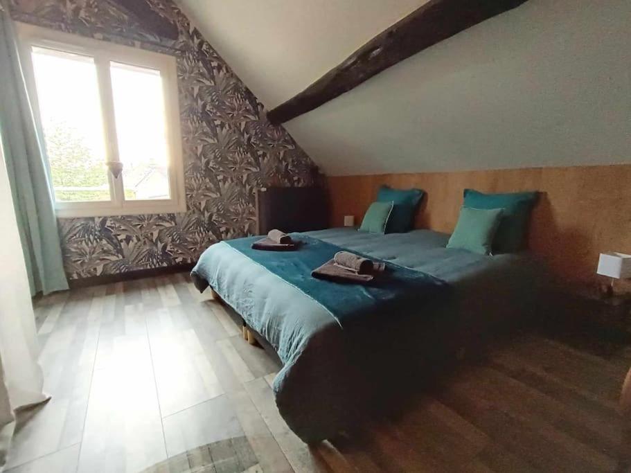 Postel nebo postele na pokoji v ubytování Gîte à côté