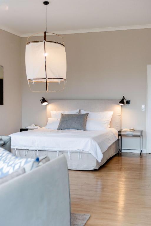 Postel nebo postele na pokoji v ubytování Aarskogs Boutique Hotel
