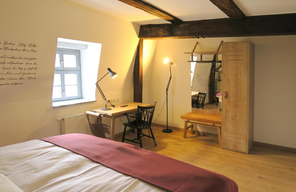 Postel nebo postele na pokoji v ubytování Gästehaus Gräf Haus