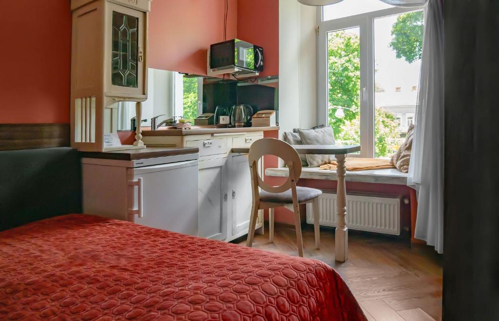Kuchyň nebo kuchyňský kout v ubytování Apart Hotel Michelle
