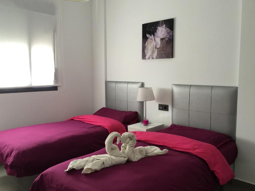 Postel nebo postele na pokoji v ubytování Apartment OasisBeach La Zenia