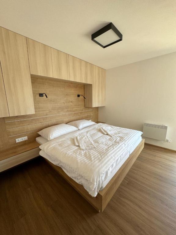Postel nebo postele na pokoji v ubytování Apartmány Římský vrch