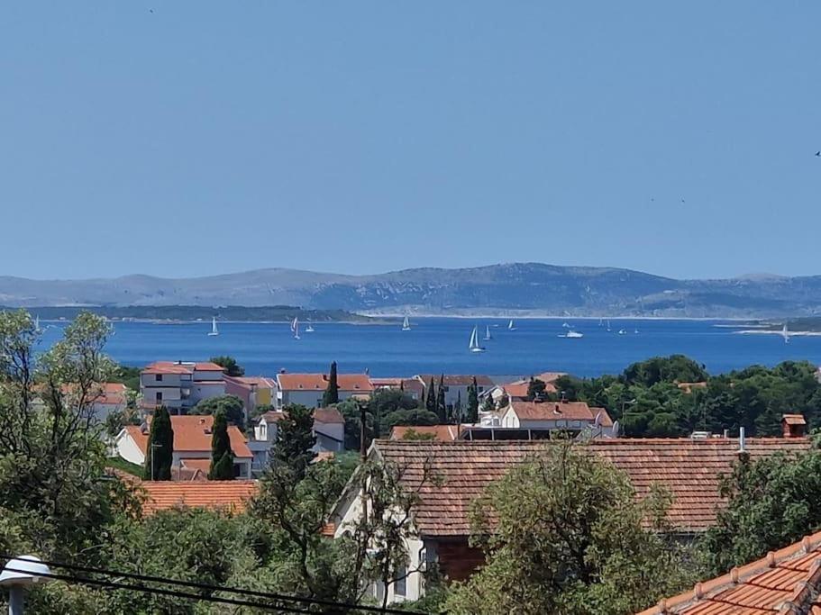 a town with a view of the water and buildings at Sea and Sun Pakoštane in Pakoštane