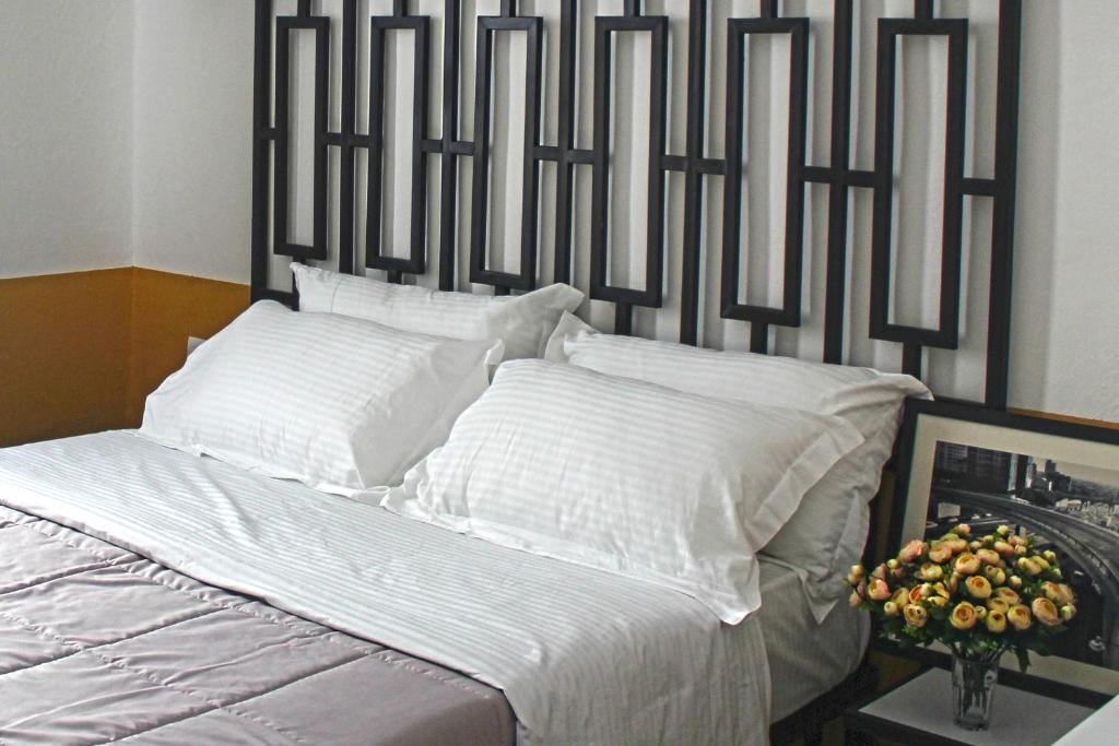 Postel nebo postele na pokoji v ubytování Hotel Antigone