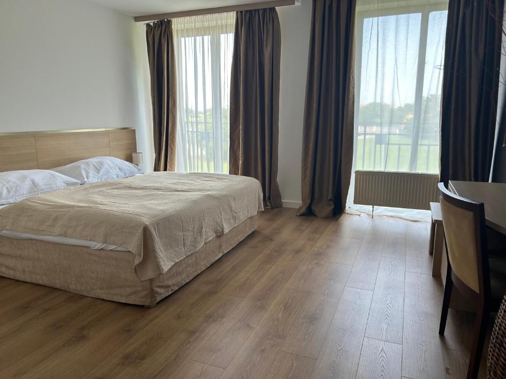 Postel nebo postele na pokoji v ubytování Hotel Legend