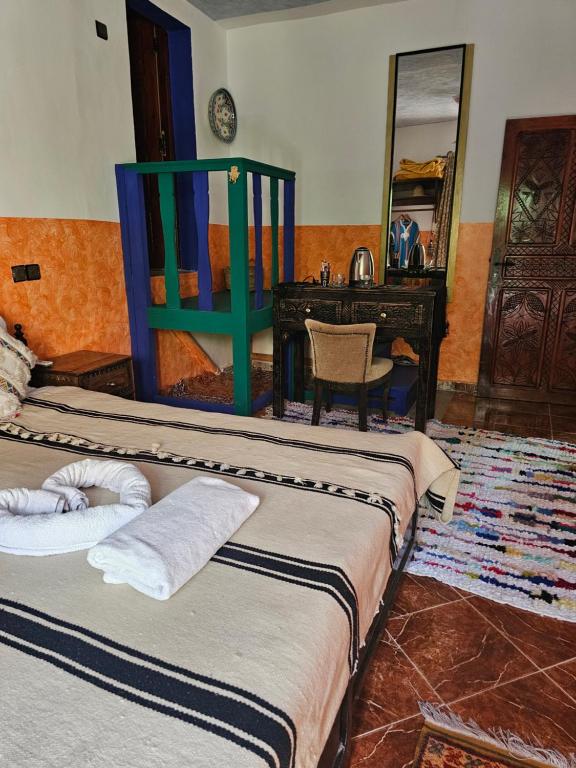 Postel nebo postele na pokoji v ubytování Riad Oussagou