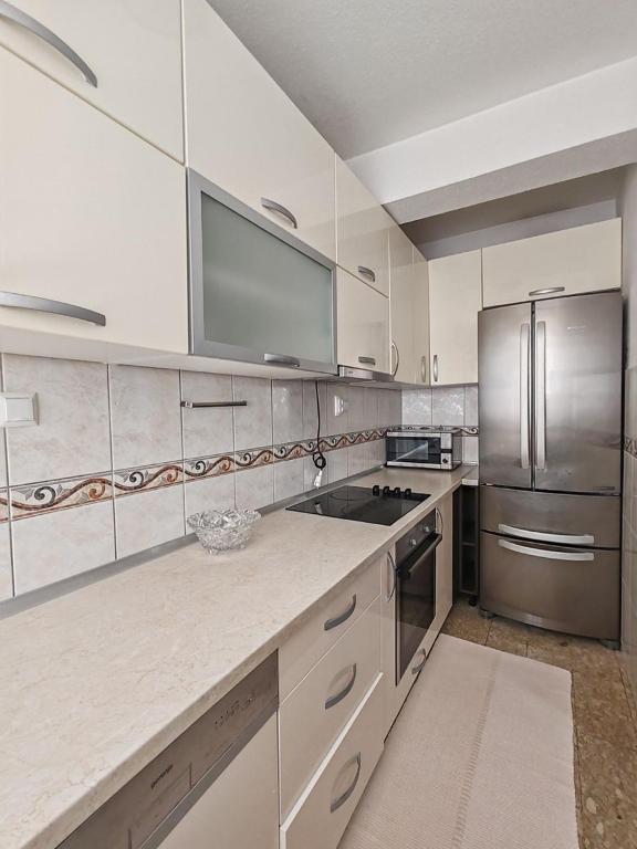 Kuchyň nebo kuchyňský kout v ubytování Apartments Lucerna