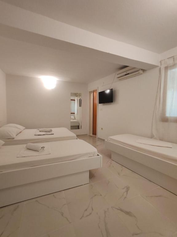 Postel nebo postele na pokoji v ubytování Apartments Lucerna