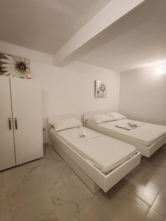 Postel nebo postele na pokoji v ubytování Apartments Lucerna