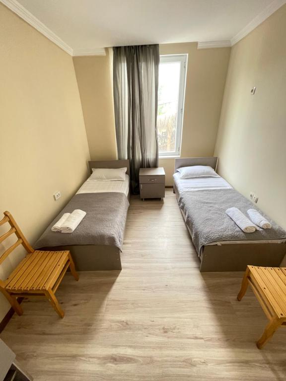 Postel nebo postele na pokoji v ubytování Barakat Hotel