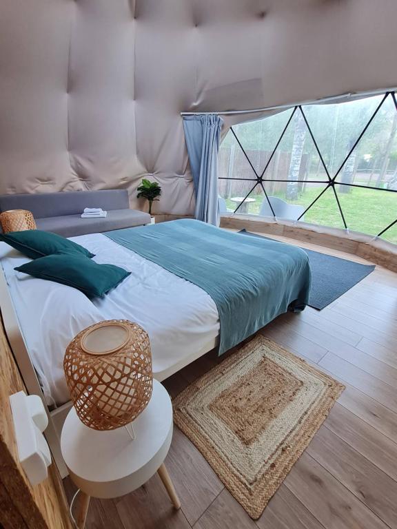 Postel nebo postele na pokoji v ubytování Glamping Cañon del Rio Lobos