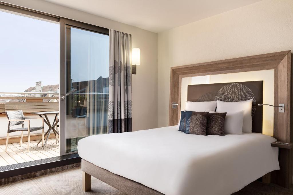 Postel nebo postele na pokoji v ubytování Novotel Genève Centre