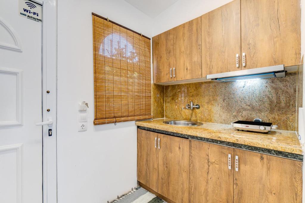 Kuchyň nebo kuchyňský kout v ubytování Doliva Studio John private jacuzzi