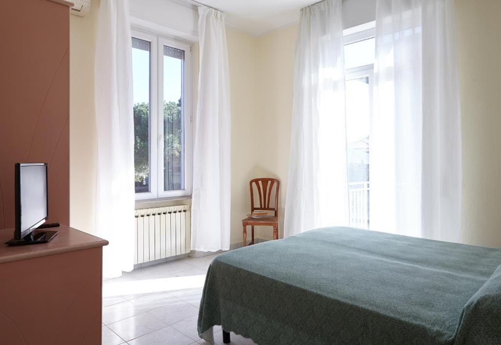 Postel nebo postele na pokoji v ubytování Hotel Mirage