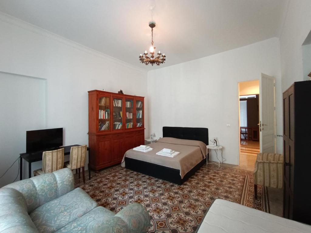 Postel nebo postele na pokoji v ubytování Il Genio del Porto - Mabbonath b&b